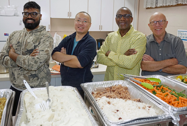The brothers getting ready to dish out Christmas dinner to guests.